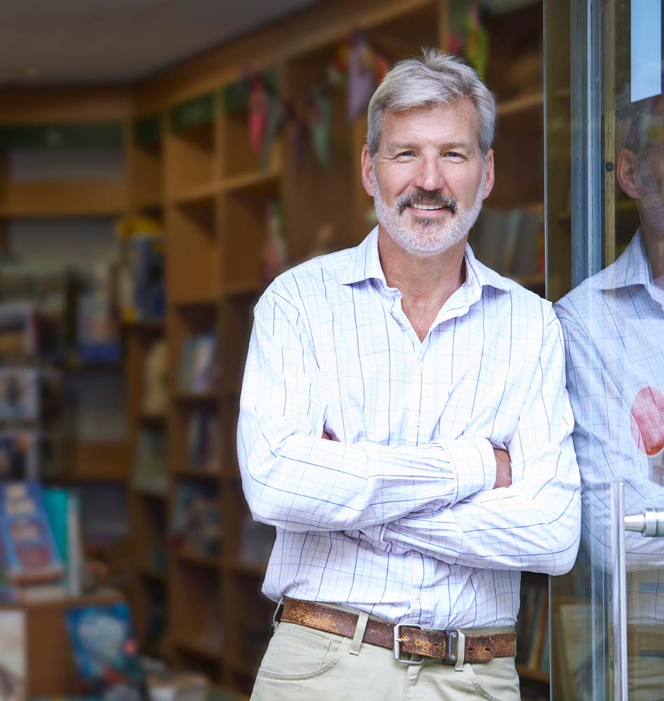 Portrait Of Male Bookshop Owner Outside Store